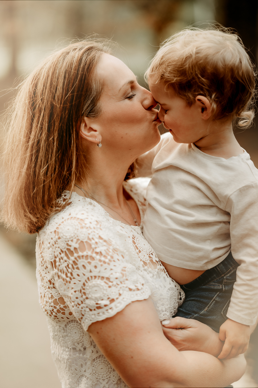 Mum kissing toddler on the nose